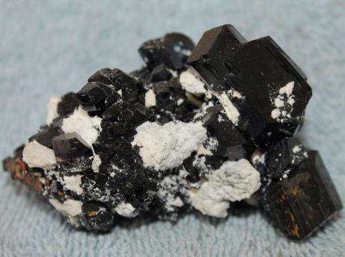 Black tourmaline crystals with feldspar